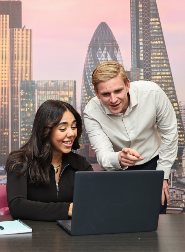 Two EWI Recruiters evaluating a candidate on a screen