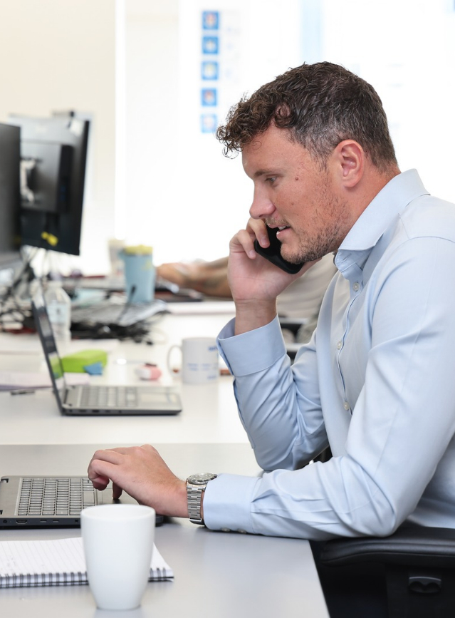 EWI Recruiter speaking on phone
